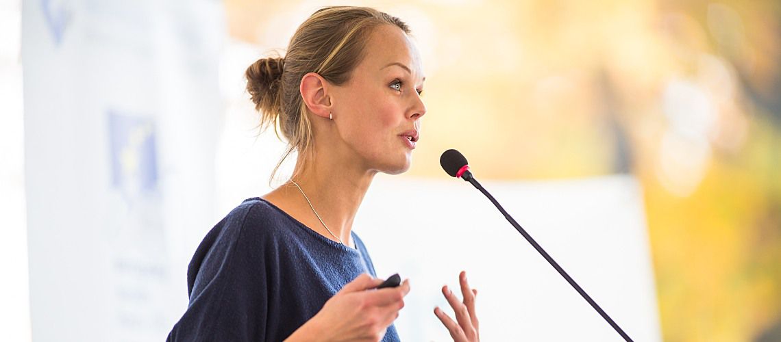 Female speaker at a large veterinary conference.