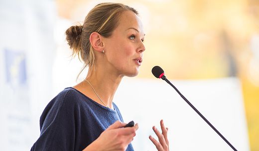 Female speaker at a large veterinary conference.