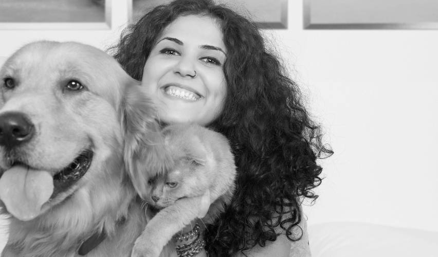 Woman with cat and dog.